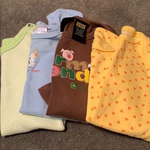 Lot of 4 onesies size 3-6 months